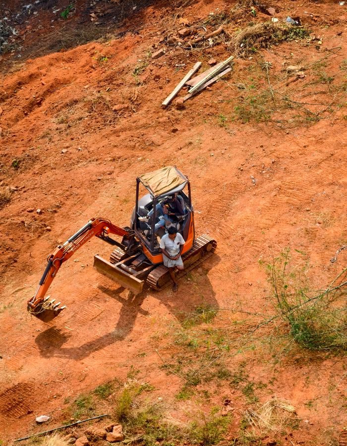 Industrial excavator digging on a construction site, highlighting earth-moving operations.